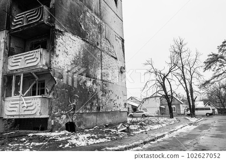IRPIN, UKRAINE - NOVEMBER 29, 2022: Irpin, Ukraine - Banksy graffiti on the wall of a destroyed house, black and white photo IRPIN, UKRAINE - NOVEMBER 29, 2022: Irpin, Ukraine - Banksy graffiti on the wall of a destroyed house, black and white photo 102627052