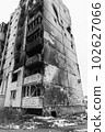 IRPIN, UKRAINE - NOVEMBER 29, 2022: Drawing by Banksy on the wall of a house in Irpin, Ukraine, black and white photo 102627066