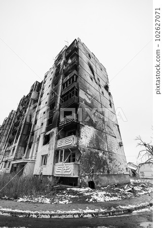 IRPIN, UKRAINE - NOVEMBER 29, 2022: Drawing by Banksy on the wall of a house in Irpin, Ukraine, black and white photo 102627071