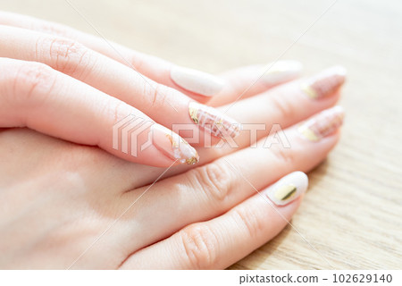 A woman's hand with fashionable nails A woman's hand with fashionable nails 102629140