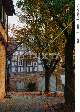 The Old Fachwerk houses in Germany. Scenic view of ancient medieval urban street architecture with half-timbered houses in the Old Town of Germany. The Old Fachwerk houses in Germany. Scenic view of ancient medieval urban street architecture with half-timbered houses in the Old Town of Germany. 102630257