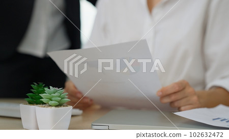 Business officer brainstorming and talking in office 102632472