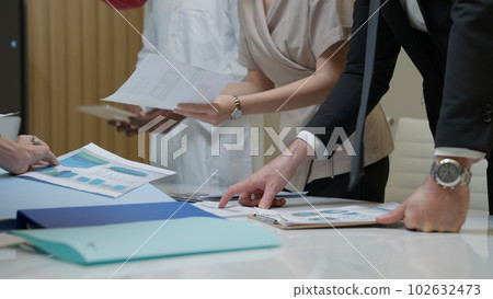 Business officer team consulting together with new project Business officer team consulting together with new project 102632473