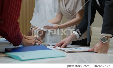 Business officer team consulting together with new project Business officer team consulting together with new project 102632476