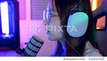 Close up view of young female gamer playing online game on computer 102632484