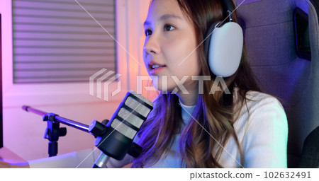 Close up view of young female gamer playing online game on computer 102632491