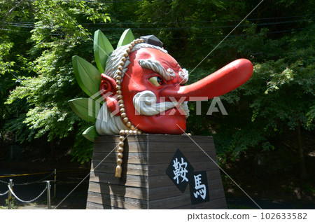 The verdant Kurama-dera Tengu mask in front of Kurama Station, Sakyo Ward, Kyoto City 102633582