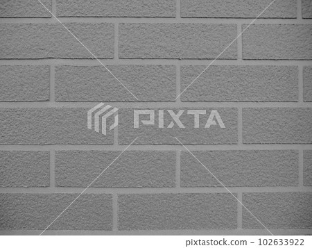 Exterior wall made of imitation bricks. Monochrome. 102633922