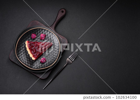 Delicious fragrant sweet pie with cherry berries on a ceramic plate Delicious fragrant sweet pie with cherry berries on a ceramic plate 102634100