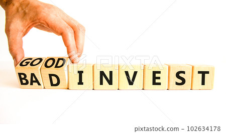 Good or bad invest symbol. Concept word Good invest and Bad invest on wooden cubes. Beautiful white table white background. Businessman hand. Business good or bad invest concept. Copy space. Good or bad invest symbol. Concept word Good invest and Bad invest on wooden cubes. Beautiful white table white background. Businessman hand. Business good or bad invest concept. Copy space. 102634178