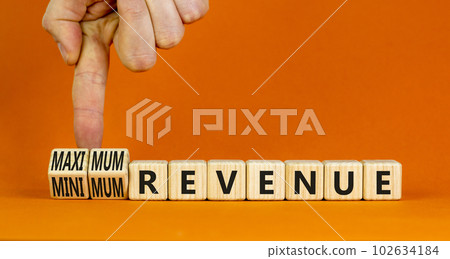 Maximum or minimum revenue symbol. Concept words Maximum revenue and Minimum revenue on wooden cubes. Beautiful orange table orange background. Business maximum or minimum revenue concept. Copy space. Maximum or minimum revenue symbol. Concept words Maximum revenue and Minimum revenue on wooden cubes. Beautiful orange table orange background. Business maximum or minimum revenue concept. Copy space. 102634184