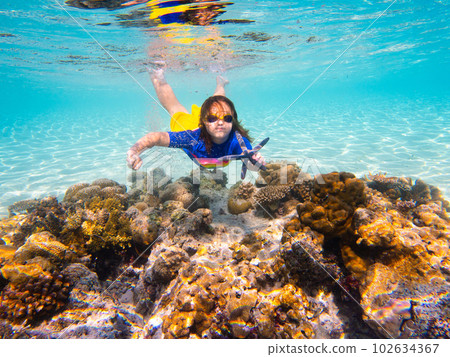 Child snorkeling. Kids underwater. Beach and sea. 102634367