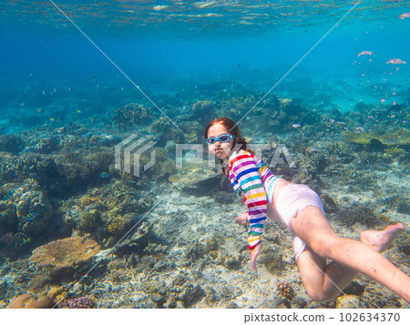 Child snorkeling. Kids underwater. Beach and sea. 102634370