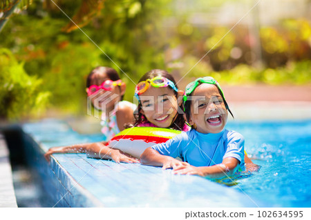 Kids in swimming pool. Children swim. Family fun. 102634595