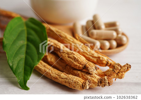 Ginseng roots and green leaf, healthy food. 102638362