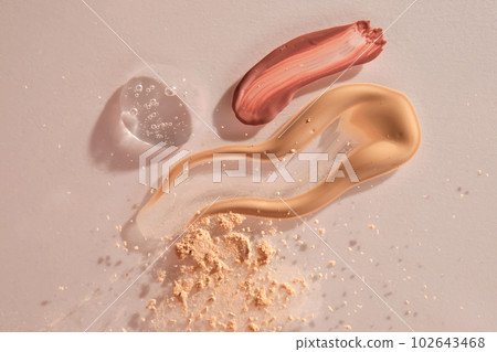 A sample of red lip gloss, foundation, powder and gel makeup base. A sample of red lip gloss, foundation, powder and gel makeup base. 102643468