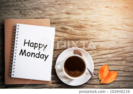 Blank notepad and coffee cup on wooden table Blank notepad and coffee cup on wooden table 102648216