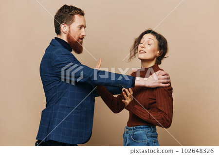 Man and woman couple in a relationship quarrel, yelling, psychological violence in the family, problems in a real relationship between people Man and woman couple in a relationship quarrel, yelling, psychological violence in the family, problems in a real relationship between people 102648326