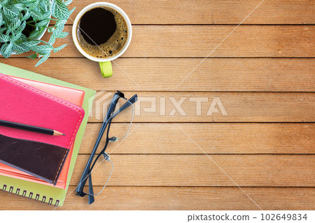 Flat lay wood office desk with office equipment Flat lay wood office desk with office equipment 102649834