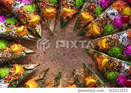 Decorated Bangladeshi Traditional garnish Colorful  masala kasturi paan or betel leaf      102651852