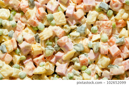 Olivier salad close-up, above view. Mayonnaise salad full frame background 102652099