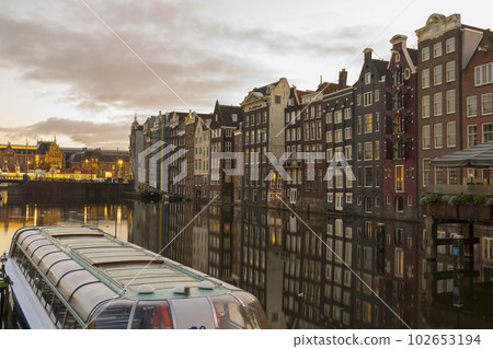 Dutch dancing houses at the Amsterdam canal in Holland. Dutch dancing houses at the Amsterdam canal in Holland. 102653194