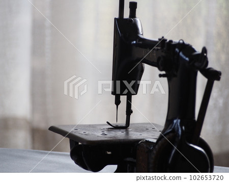 Antique sewing machine Antique sewing machine 102653720