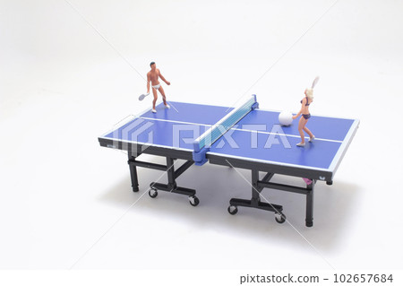 a figure play tennis on the pingpong table 102657684