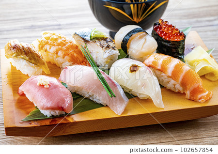Nigiri sushi served on a plate 102657854