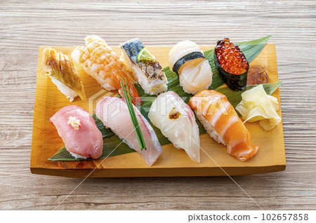 Nigiri sushi served on a plate 102657858