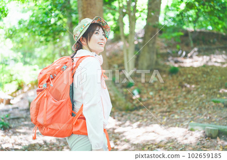 Profile of a woman who enjoys climbing 102659185