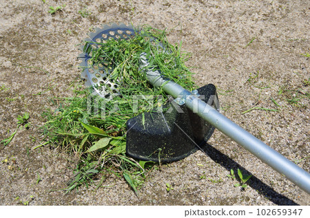 Grass wrapped around lawn mower blades 102659347