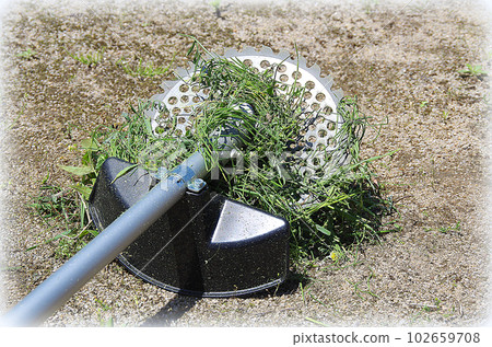 Grass wrapped around the blade of the mower (illustration style) 102659708