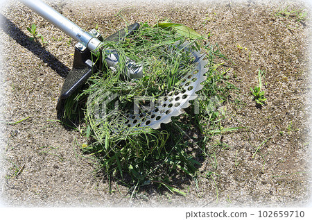 Grass wrapped around the blade of the mower (illustration style) 102659710