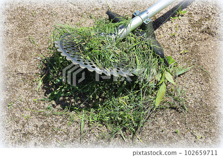Grass wrapped around the blade of the mower (illustration style) 102659711