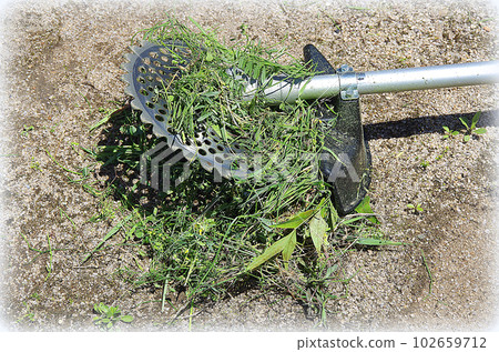 Grass wrapped around the blade of the mower (illustration style) 102659712