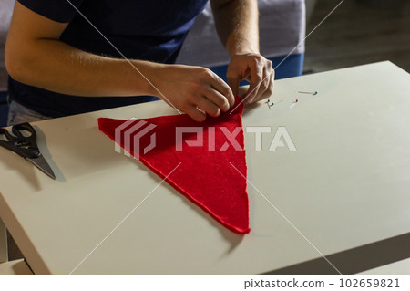 Homemade sewing of Christmas hat 102659821