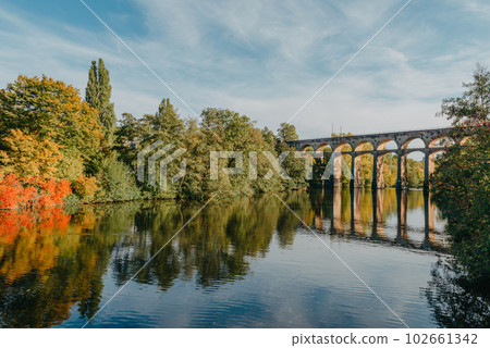 Railway Bridge with river in Bietigheim-Bissingen, Germany. Autumn. Railway viaduct over the Enz River, built in 1853 by Karl von Etzel on a sunny summer day. Bietigheim-Bissingen, Germany. Old Railway Bridge with river in Bietigheim-Bissingen, Germany. Autumn. Railway viaduct over the Enz River, built in 1853 by Karl von Etzel on a sunny summer day. Bietigheim-Bissingen, Germany. Old 102661342