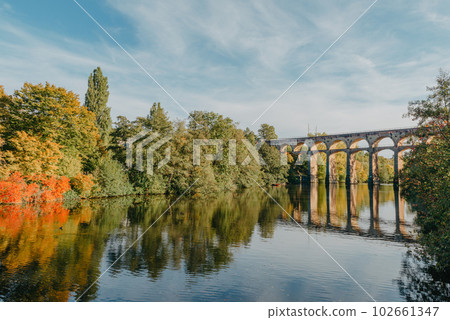 Railway Bridge with river in Bietigheim-Bissingen, Germany. Autumn. Railway viaduct over the Enz River, built in 1853 by Karl von Etzel on a sunny summer day. Bietigheim-Bissingen, Germany. Old Railway Bridge with river in Bietigheim-Bissingen, Germany. Autumn. Railway viaduct over the Enz River, built in 1853 by Karl von Etzel on a sunny summer day. Bietigheim-Bissingen, Germany. Old 102661347