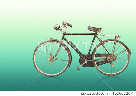 side view old and rust black and silver bicycle on gradient green background, object, decor, transport, copy space 102662207