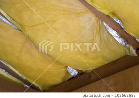 Exposed old roof insulation Exposed old roof insulation 102662682