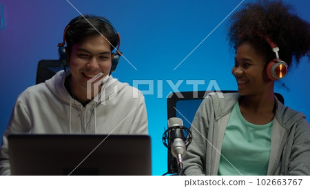 Game streamer using pc setup playing multiplayer first person shooter Game streamer using pc setup playing multiplayer first person shooter 102663767