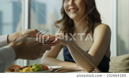Happy couple dinner on high building with city skyline view Happy couple dinner on high building with city skyline view 102664169