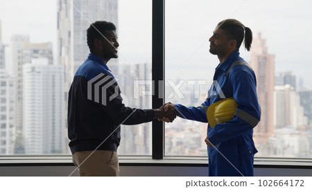 Handshake between engineer foreman manager and electrician 102664172