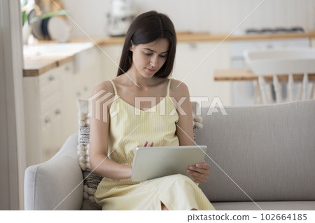 Serious young student girl using modern technology, Internet application Serious young student girl using modern technology, Internet application 102664185