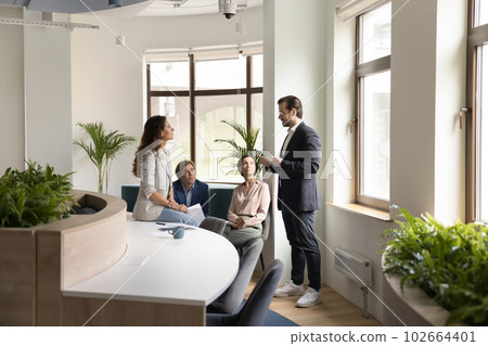 Confident boss lead morning briefing for corporate staff members 102664401