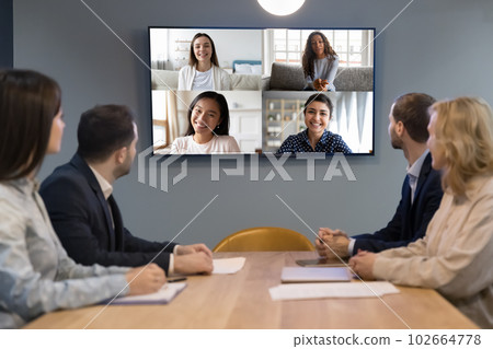 Office video conference meeting of diverse business team Office video conference meeting of diverse business team 102664778