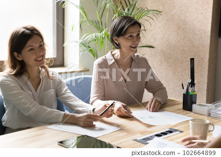 Office employees take part in group meeting in conference room 102664899
