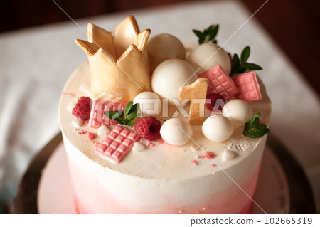 Top of Birthday cake for a girl on her first birthday Top of Birthday cake for a girl on her first birthday 102665319