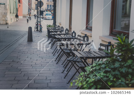 Street caffe in Krakow old town, Poland Street caffe in Krakow old town, Poland 102665346